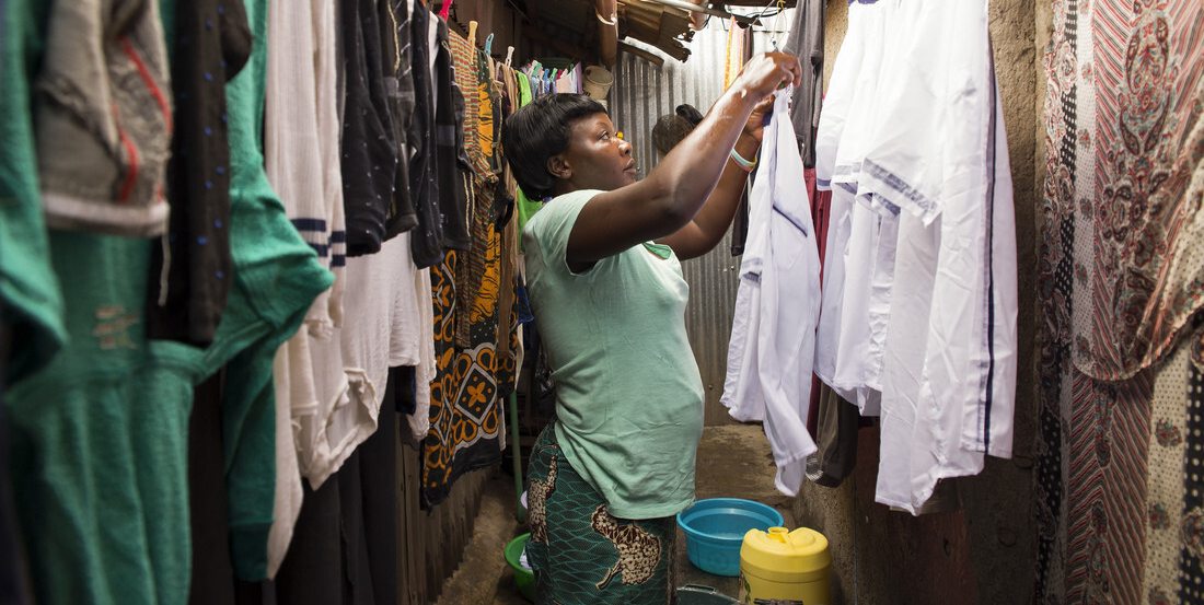 woman hanging clothes up