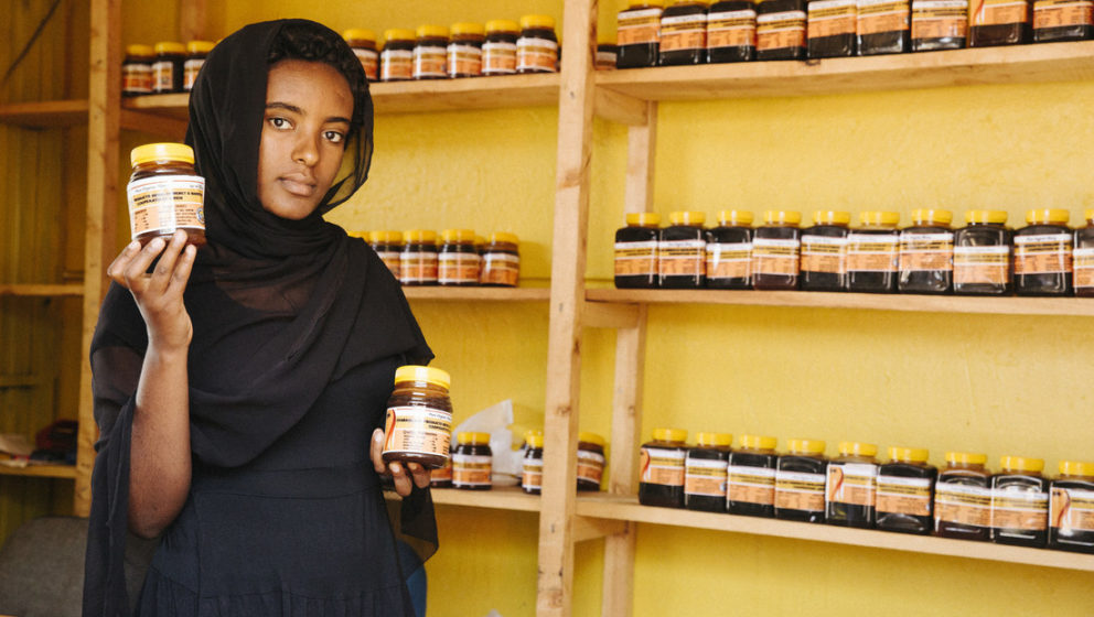 Ethiopian woman holding honey